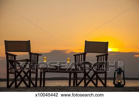 Stock Photo Of Beach Table And Chairs For Two At Sunset X10045442 Beach Table And Chairs For Two At Sunset