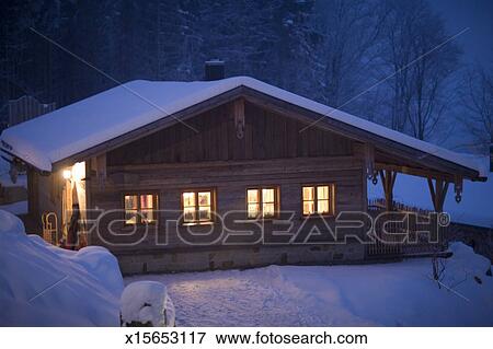 Illuminated Log Cabin At Night In Snow Stock Photo X15653117