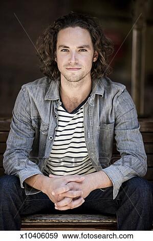 Portrait Of Long Haired Blue Eyed Man Stock Photo X10406059