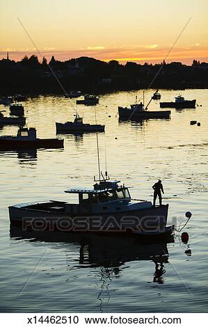 Download Silhouette of lobster boats and lobstermen Maine Stock ...