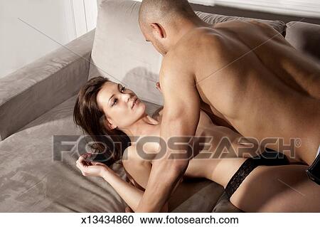 Young Couple Making Love On Couch Stock Image X13434860 Fotosearch