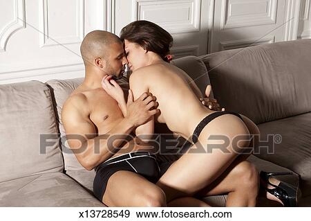 Young Couple Making Love On Couch Stock Photo X13728549 Fotosearch