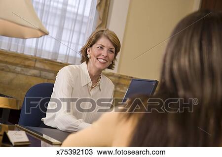 Stock Photo - Loan officer at meeting. Fotosearch - Search Stock Images, Poster Photographs, Pictures, and Clip Art Photos