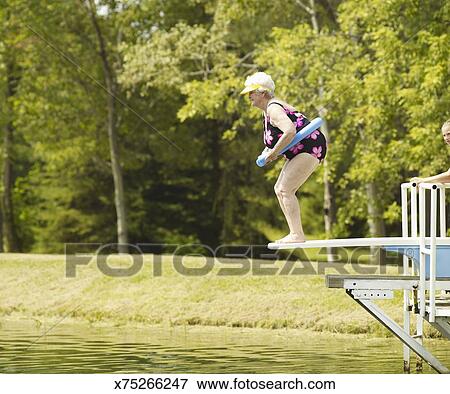 Picture Of Senior Woman Standing On Diving Board Side View Picture Of Senior Woman Standing On Diving Board Side View