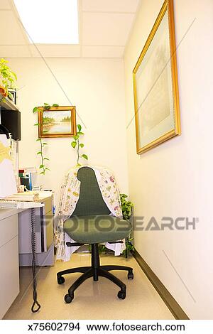 Stock Photo Of A Nurse S Jacket Hangs Over The Chair At A Desk