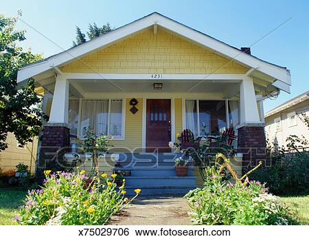 Yellow Bungalow Style House With Garden Exterior View Stock
