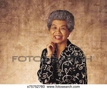 Asian Woman With Graying Hair Smiling Stock Image X75752760