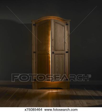 Stock Photo Of Light Shining Out Of Wardrobe Door X75085464