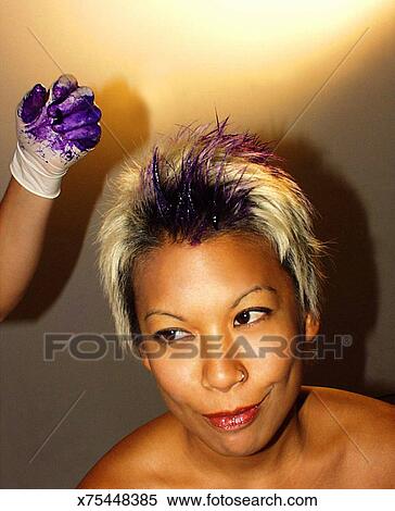 Woman Having Purple Hair Dye Applied Stock Photography X75448385