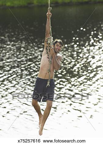 Man Hanging From Rope On Blue Background D9 46 510