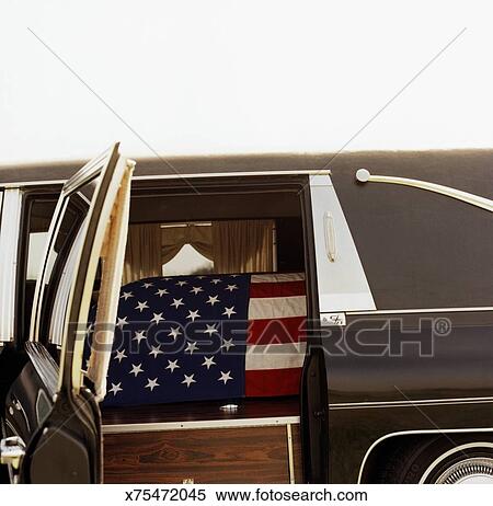 American Flag Draped Over Coffin In Hearse Stock Photography