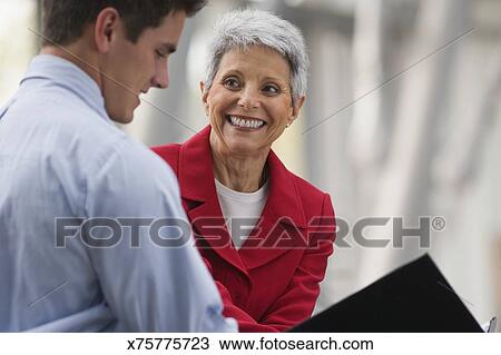 Stock Photo - Businesswoman with intern. Fotosearch - Search Stock Images, Poster Photographs, Pictures, and Clip Art Photos