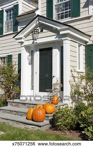 Pumpkins On Front Door Steps Stock Photograph