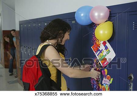 Teenage Girl 14 16 At School Locker With Birthday Decorations