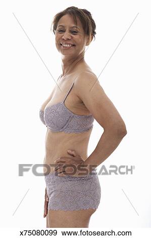 Download Mature woman wearing bra and panties, hand on hip ...