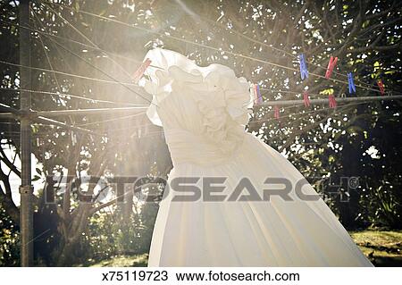 Wedding Dress Hanging On Hills Hoist Clothes Line Stock Image