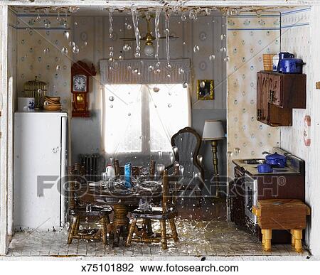 Flooded House And Ceiling Leaking Water Into Kitchen Stock Image