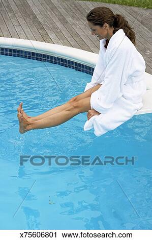 Stock Photography Of Young Woman On Diving Board Dipping Feet In Stock Photography Of Young Woman On Diving Board Dipping Feet In