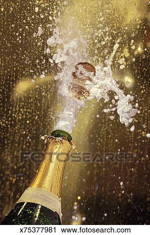 Stock Photography Of Cork Popping On Champagne Bottle X75377981
