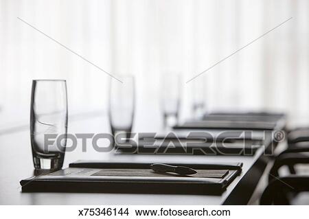 A Boardroom Table Is Set Up For A Meeting Picture