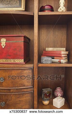 Decorative Objects On Bookshelves Stock Photo X75300837 Fotosearch