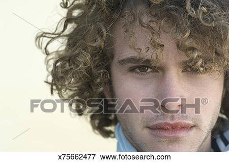 Man With Curly Hair Stock Photo X75662477 Fotosearch