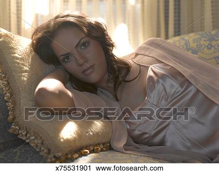 Teenage Girl 16 17 In Slip Laying On Couch Stock Image