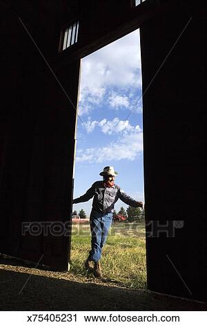 Elderly Man Closing Barn Door Stock Image X75405231 Fotosearch