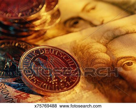 Pictures Of German Currency One Mark Coins On Fifty Banknotes German Currency One Mark Coins On Fifty Banknotes Close Up