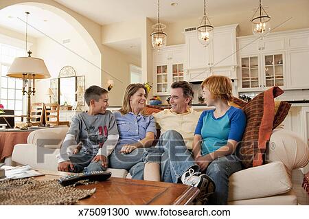 Family Relaxing On Couch At Home Stock Photography X75091300 Family Relaxing On Couch At Home