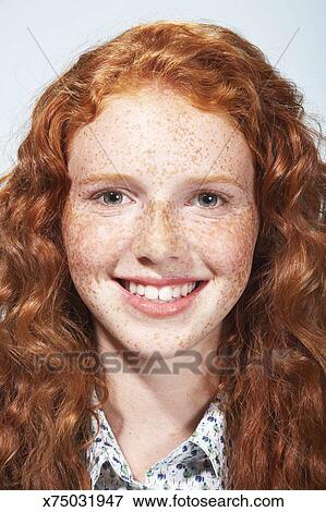Teenage Girl 13 15 With Curly Hair And Freckles Smiling
