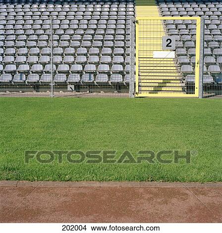 Aisle and empty seats in stadium View Large Photo Image Picture - Aisle and empty seats in stadium. Fotosearch