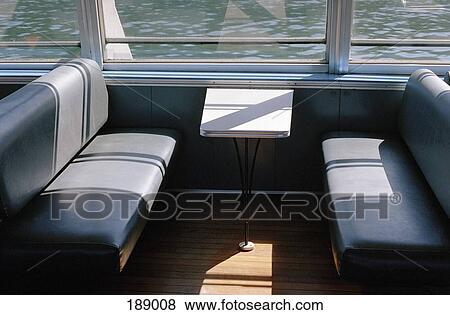 Bench seats inside a ferry View Large Photo Image Stock Photo - Bench seats inside a ferry. Fotosearch