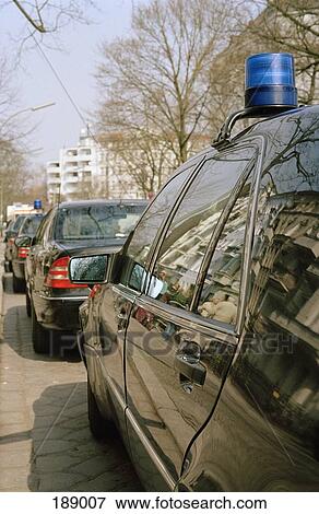 Row of stationary police cars on street View Large Photo Image Stock Photo - Row of stationary police cars on street. Fotosearch