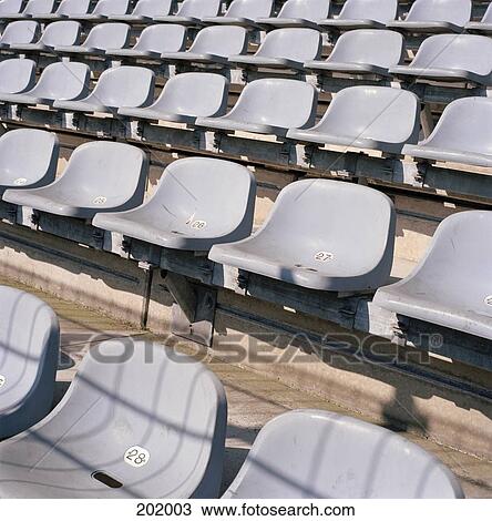 Stock Image - Rows of seats in stadium. Fotosearch