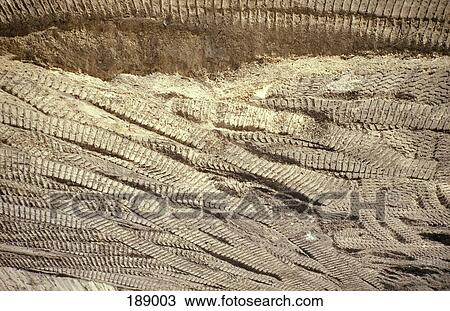 Tracks in the ground from a tractor View Large Photo Image Stock Image - Tracks in the ground from a tractor. Fotosearch