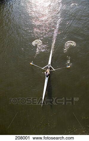 Young man sculling on a river View Large Photo Image Stock Image - Young man sculling on a river. Fotosearch