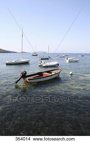 Boats moored in shallow water View Large Photo Image Picture - Boats moored in shallow water. Fotosearch