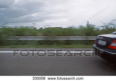 Car traveling on highway View Large Photo Image Stock Photo - Car traveling on highway. Fotosearch