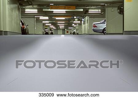 Cars in underground parking lot View Large Photo Image Stock Photo - Cars in underground parking lot. Fotosearch