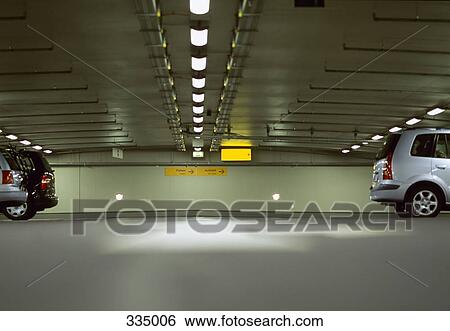 Cars in underground parking lot View Large Photo Image Stock Photograph - Cars in underground parking lot. Fotosearch