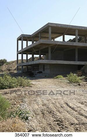 Concrete construction frame of building on hillside View Large Photo Image Stock Photo - Concrete construction frame of building on hillside. Fotosearch