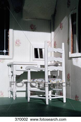 Stock Image - Miniature dressing table furniture set in a dollhouse. Fotosearch