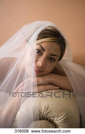 Portrait of bride leaning on leather sofa View Large Photo Image Stock Photo - Portrait of bride leaning on leather sofa. Fotosearch