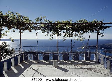 Stock Image - View out to sea from terrace, Island Cres, Croatia. Fotosearch