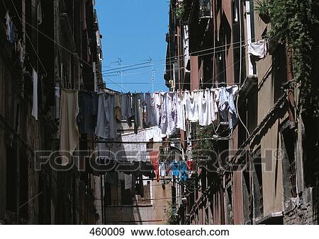 Laundry hanging between apartment buildings, Venice, Italy View Large Photo Image Stock Photo - Laundry hanging between apartment buildings, Venice, Italy. Fotosearch
