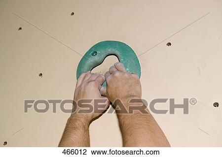 Detail of a man indoor rock climbing View Large Photo Image Stock Image - Detail of a man indoor rock climbing. Fotosearch