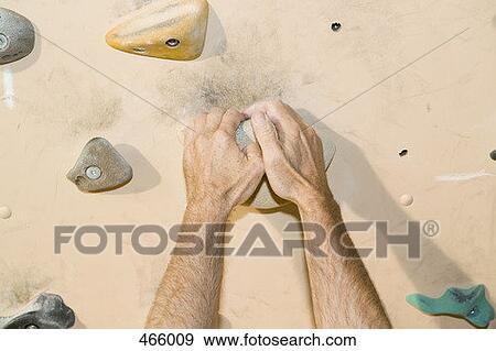 Detail of a man indoor rock climbing View Large Photo Image Stock Photo - Detail of a man indoor rock climbing. Fotosearch
