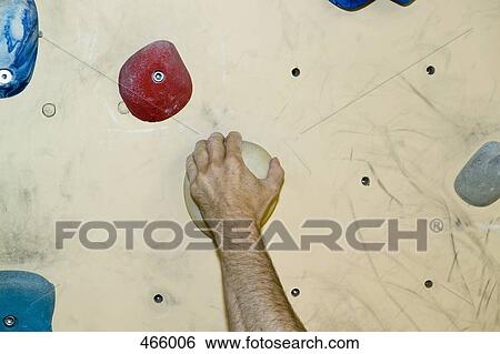 Detail of a man indoor rock climbing View Large Photo Image Stock Photograph - Detail of a man indoor rock climbing. Fotosearch