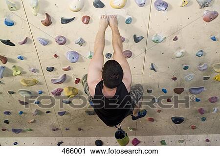 High angle view of a man indoor rock climbing View Large Photo Image Stock Image - High angle view of a man indoor rock climbing. Fotosearch